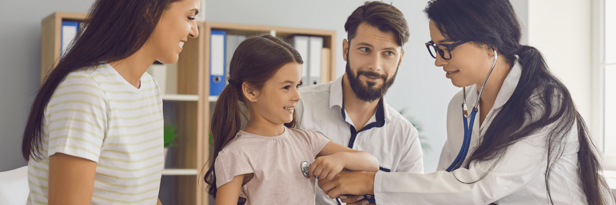 Community Health Image Doctor and Young Patient with Parents Looking On